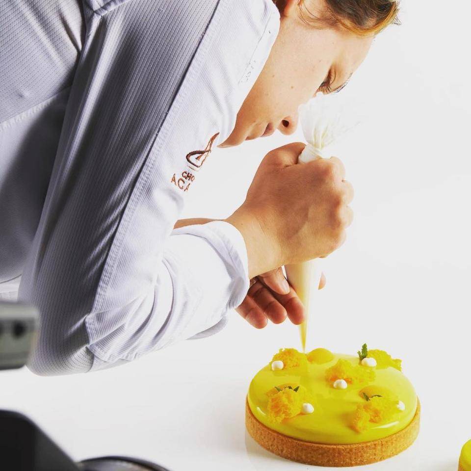 Chef Naomi puts the finishing touches on a tart