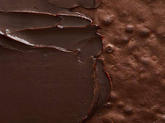 Chocolate brownie with ganache spread over half