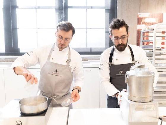 Chef Nicoll Notter and Dimitri Fayard working in the kitchen