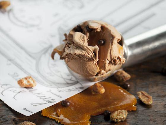 a scoop of chocolate gelato with gooey caramel sauce